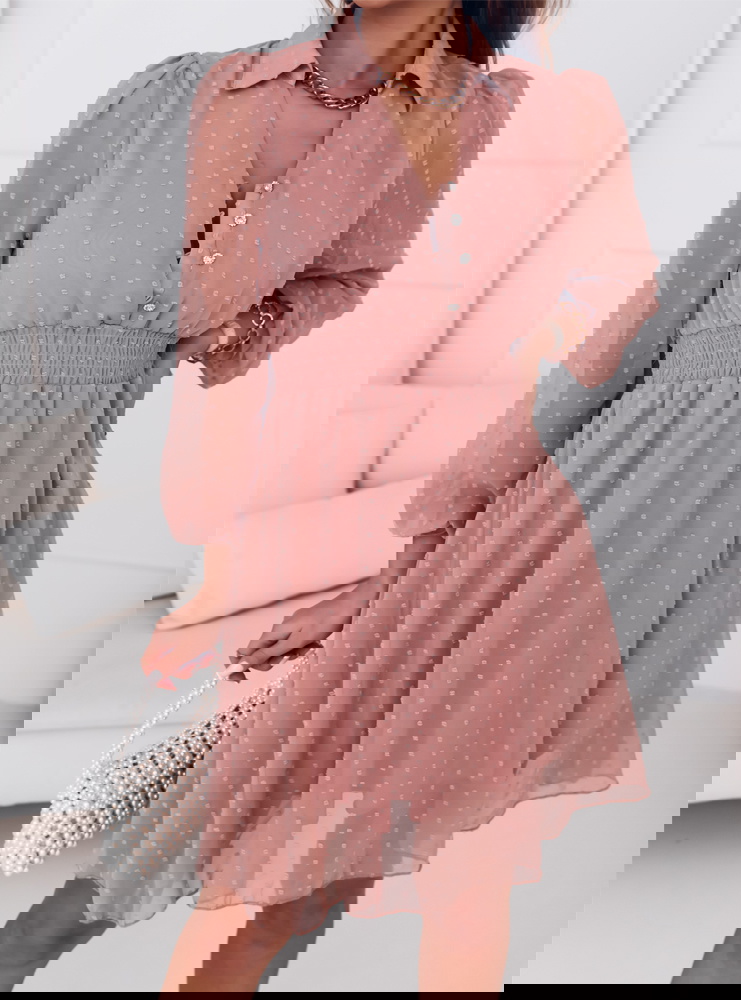 Sukienka z guzikami na dekolcie...