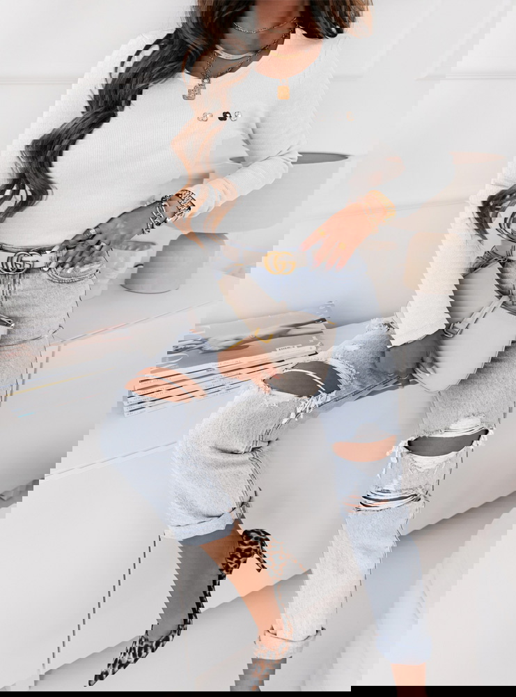 Biała prążkowana bluzka z ozdobnymi...