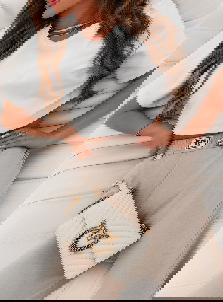 Beżowe spodnie dresowe z szerokimi...