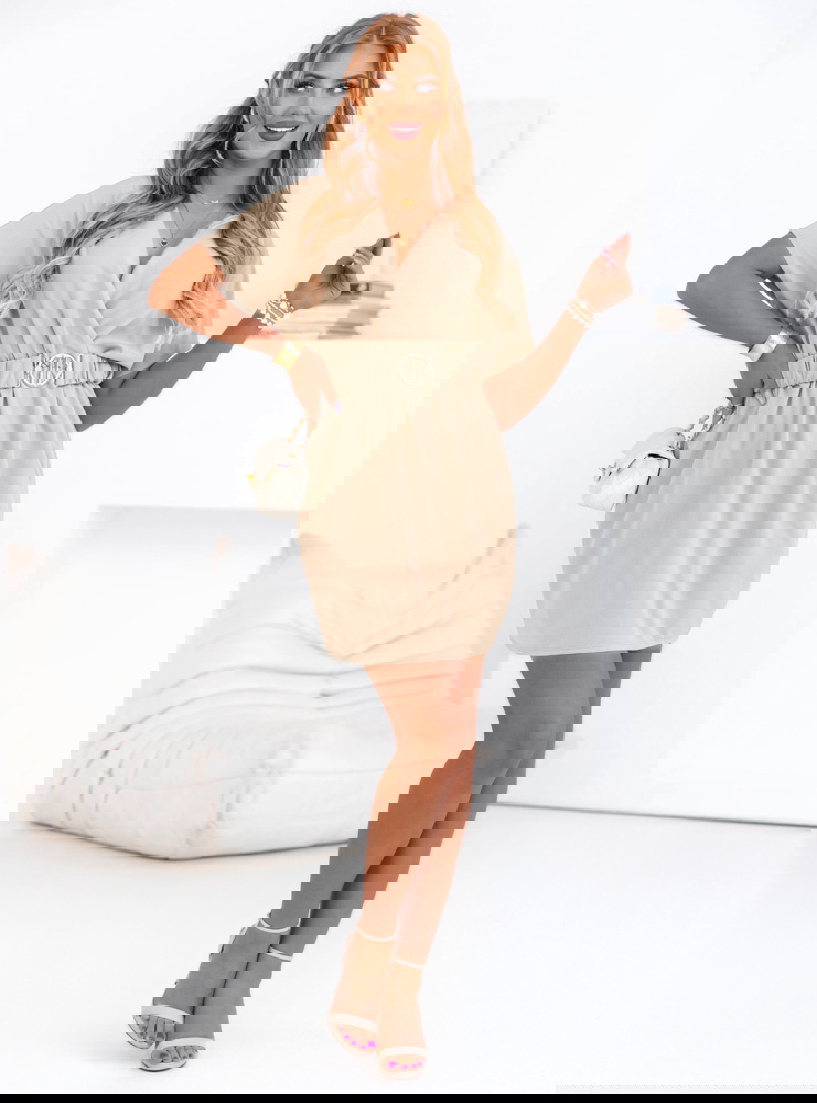 Beżowa sukienka mini z przekładanym...