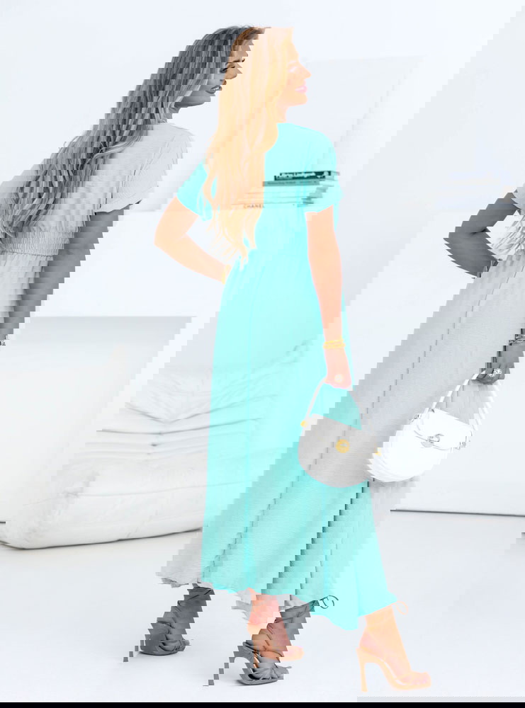 Miętowa długa sukienka z przekładanym...