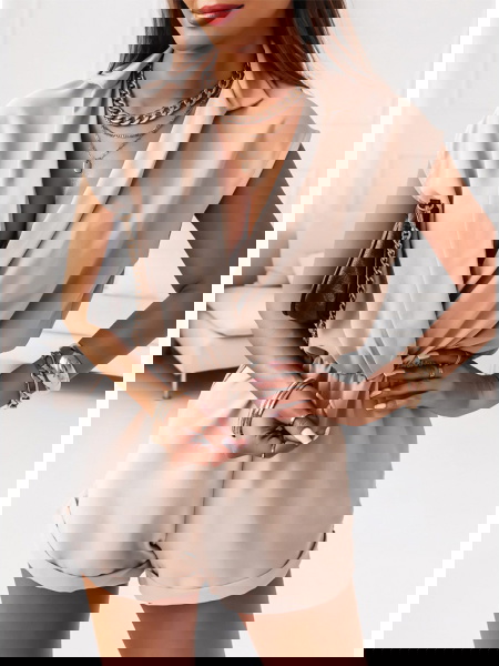 Beżowy kombinezon z...