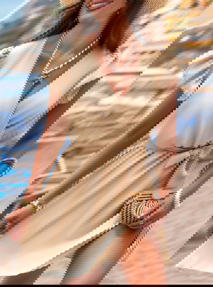 Beżowa sukienka z przekładanym...