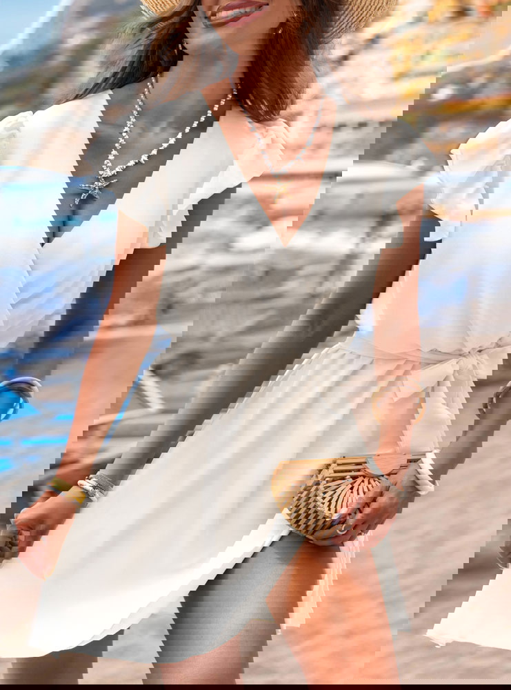 Biała sukienka z przekładanym...