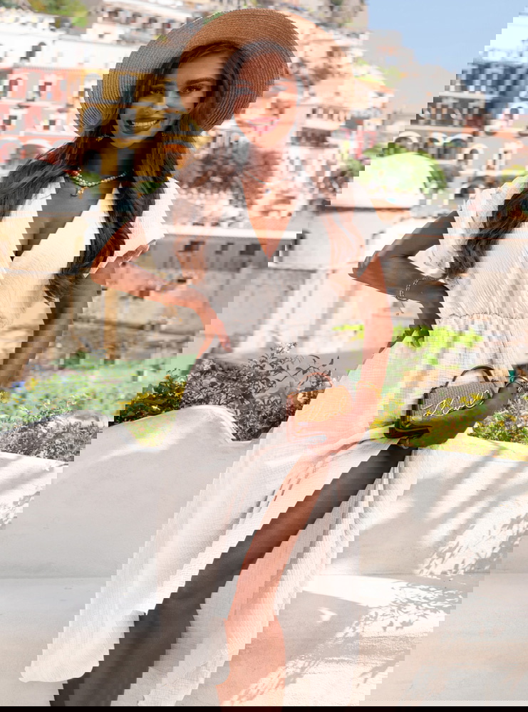 Biała muślinowa sukienka z...