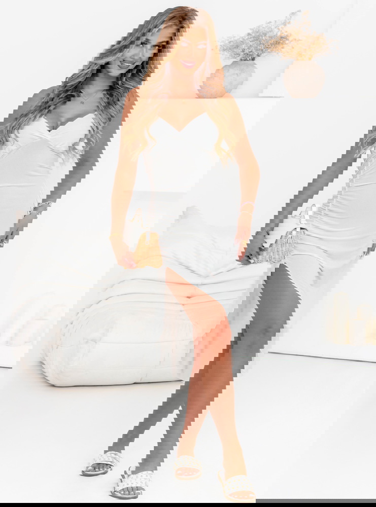 Biała sukienka na ramiączkach z...