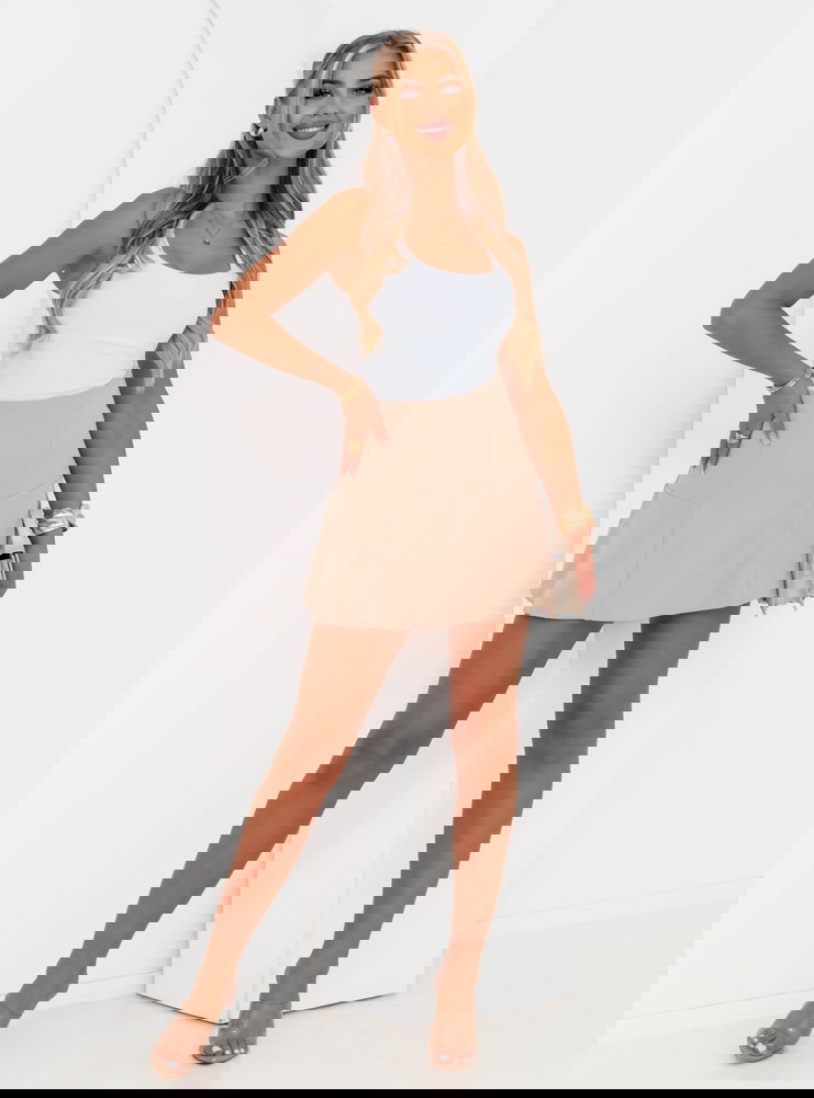 Beżowa rozkloszowana spódniczka mini...