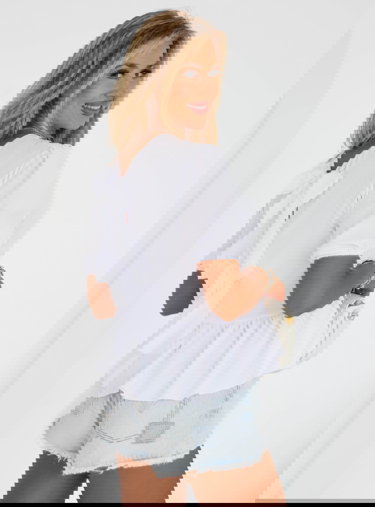 Biała bluzka z ozdobnym wiązaniem na...