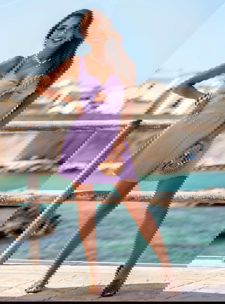 Liliowy prążkowany kombinezon z...