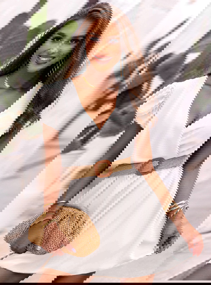 Biała sukienka z przekładanym...