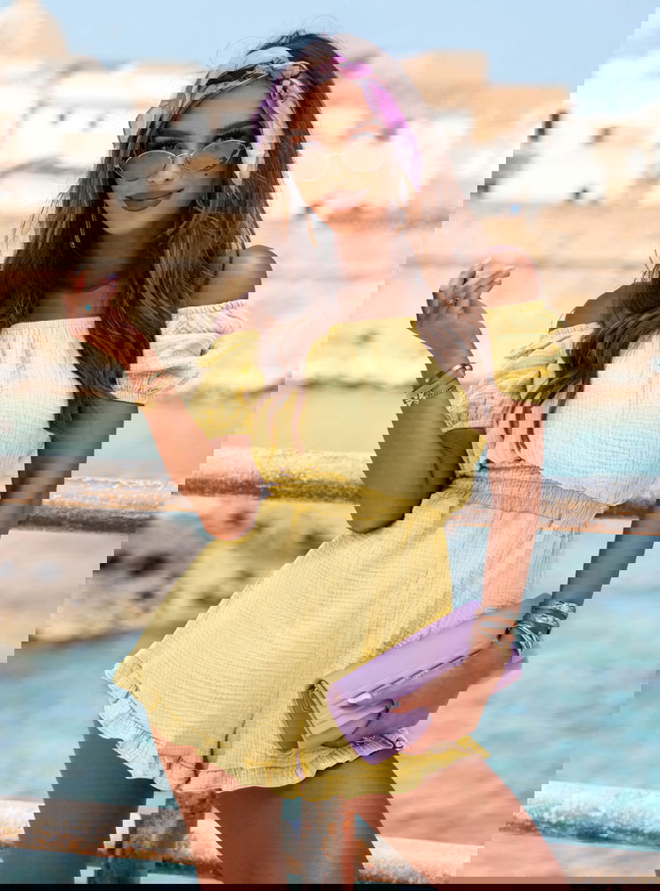 Muślinowy kombinezon z gumką w talii...