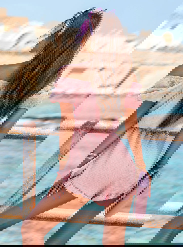 Muślinowy kombinezon z gumką w talii...