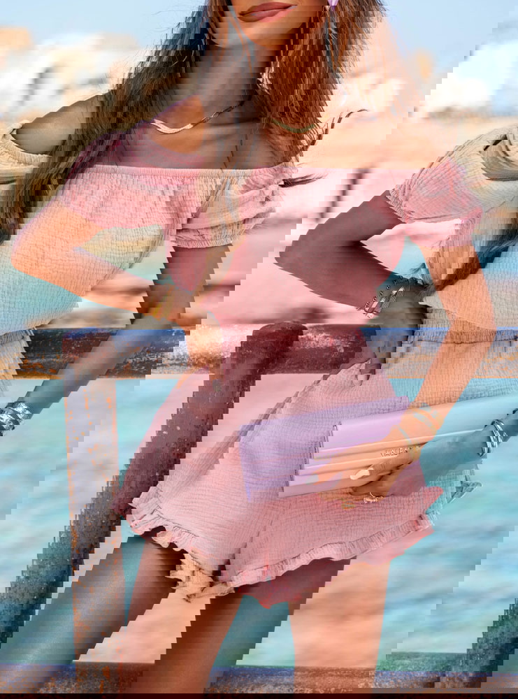 Muślinowy kombinezon z gumką w talii...