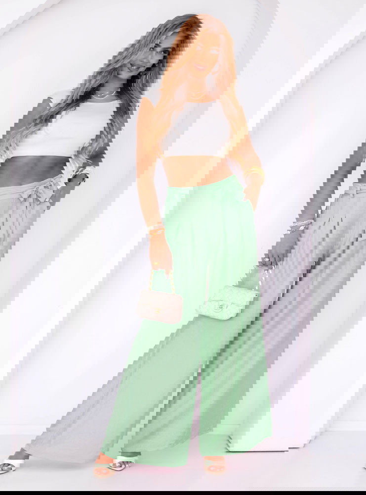 Miętowe szerokie spodnie z paskiem...