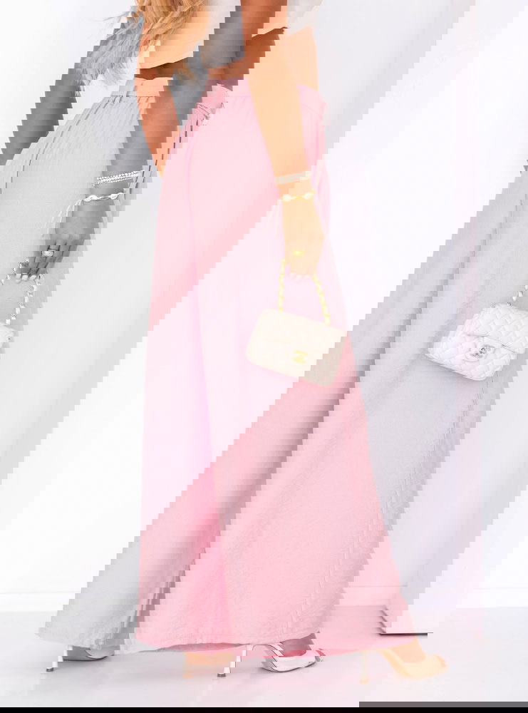 Pudrowe szerokie spodnie z paskiem...