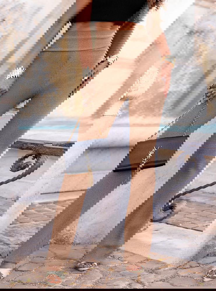 Beżowe prążkowane spodnie z...