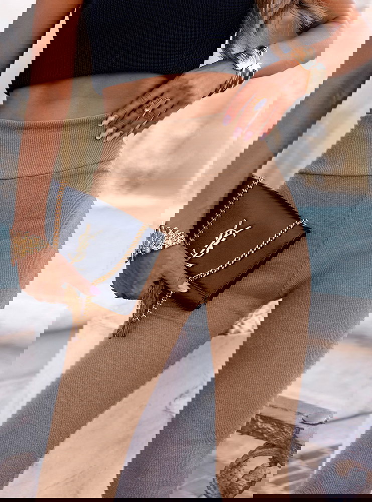 Beżowe prążkowane spodnie z...