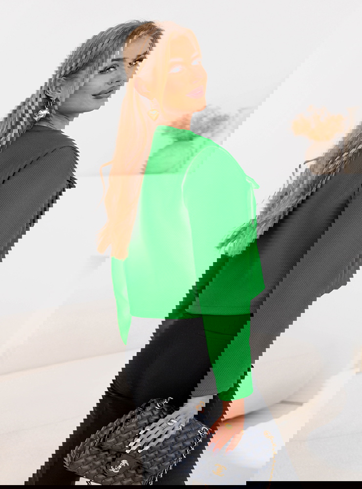 Zielona kurtka zapinana na guziki...