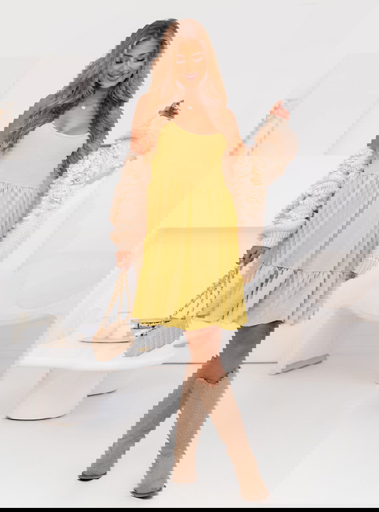 Rozkloszowana sukienka na ramiączkach...