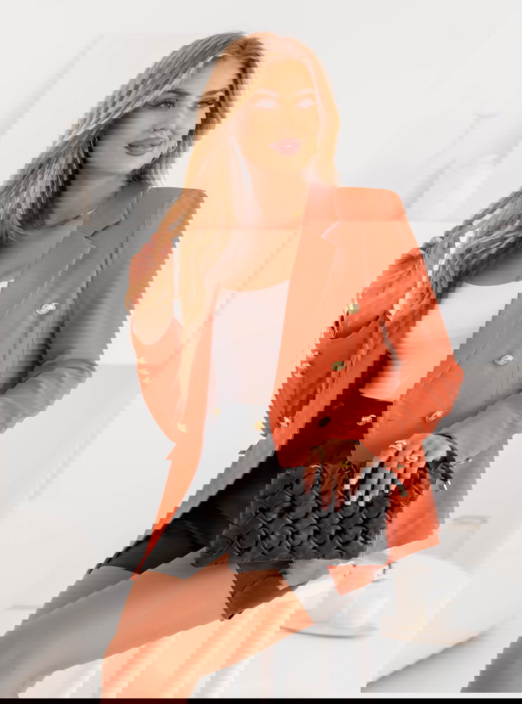 Pomarańczowa marynarka zapinana na...