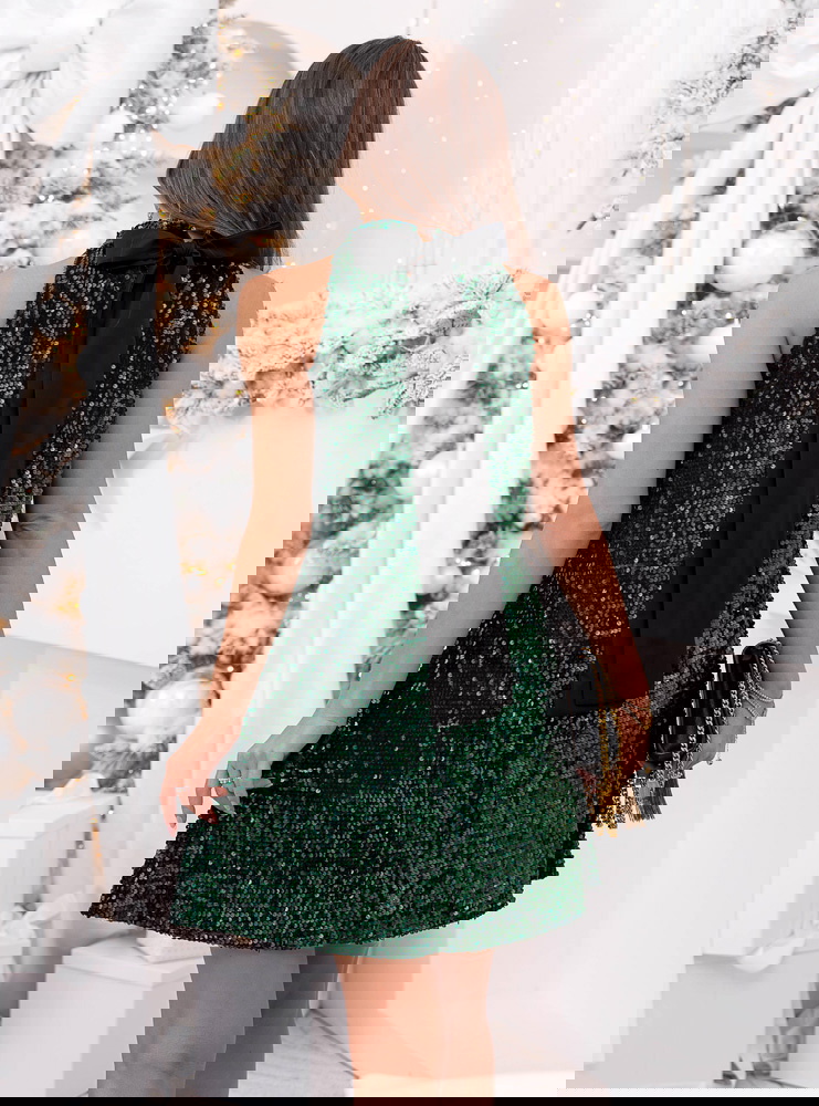 Cekinowa sukienka na święta z kokardą...