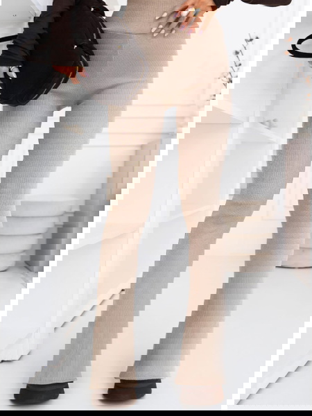 Beżowe prążkowane spodnie z...