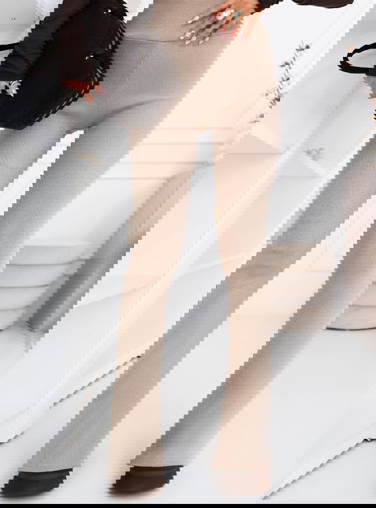 Beżowe prążkowane spodnie z...