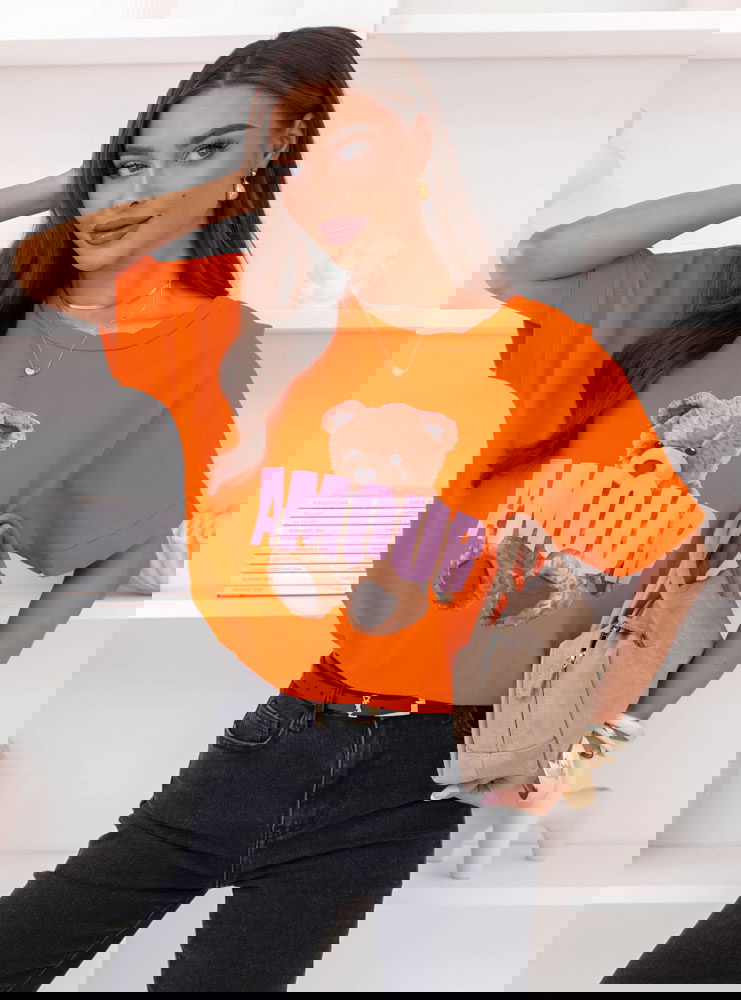 Pomarańczowa bluzka z ozdobnym...