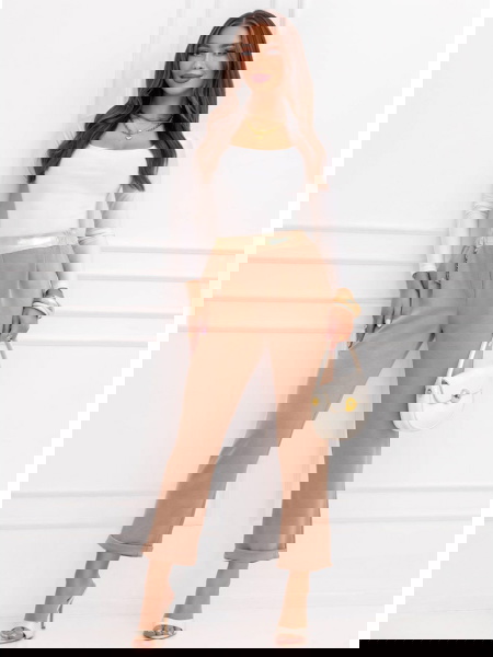 Beżowe spodnie z gumką w...