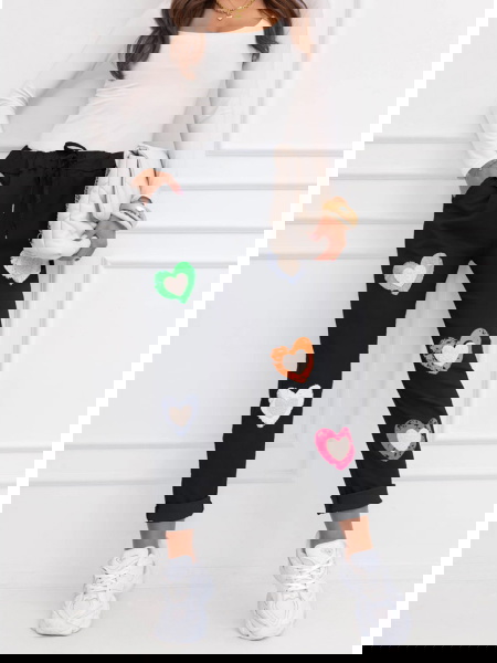 Czarne spodnie z ozdobnymi...