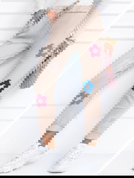 Beżowe spodnie z ozdobnymi...