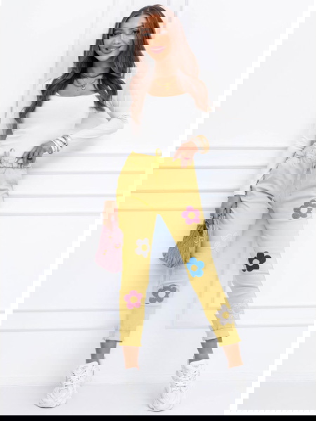 Spodnie z ozdobnymi...