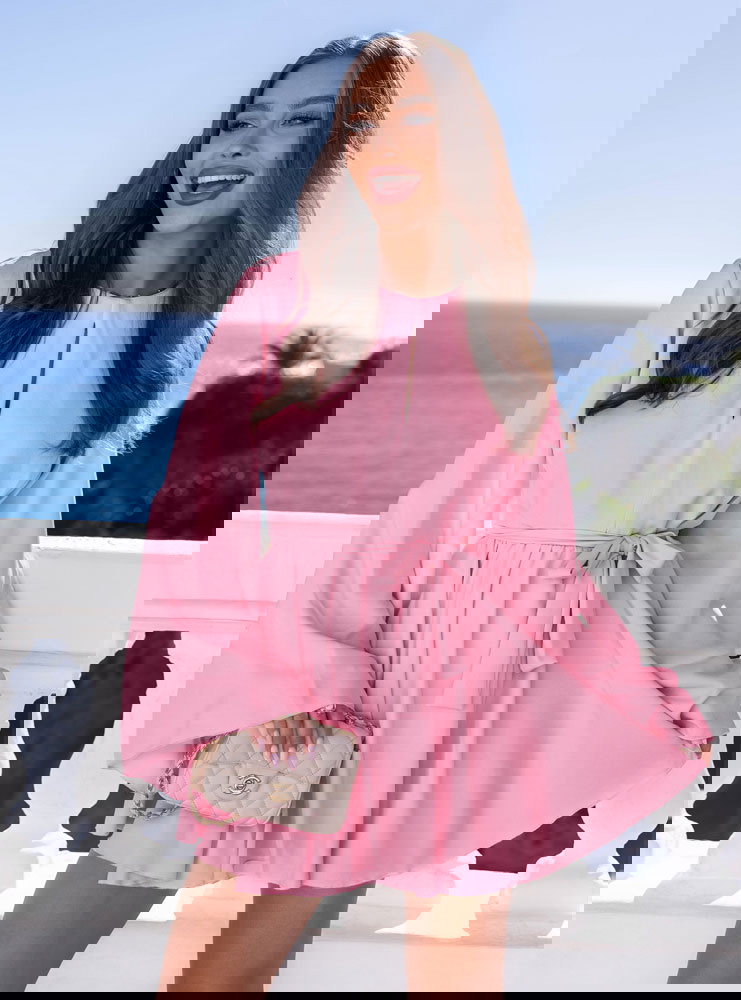 Pudrowy kombinezon jak sukienka...