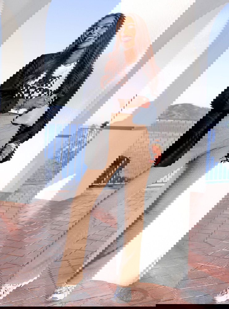 Beżowe prążkowane spodnie z...