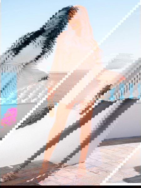 Jasnobeżowy kombinezon jak...