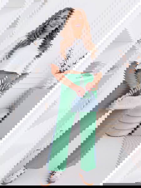 Miętowe spodnie z ozdobnymi...