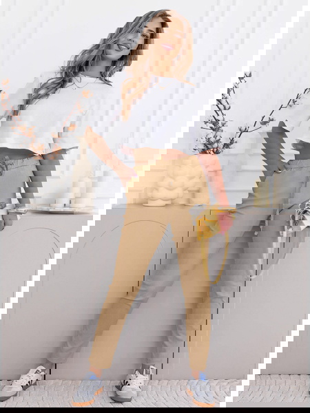 Beżowe spodnie z ozdobnym... 2