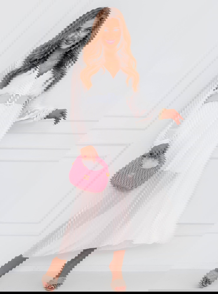 Biała sukienka z przekładanym...