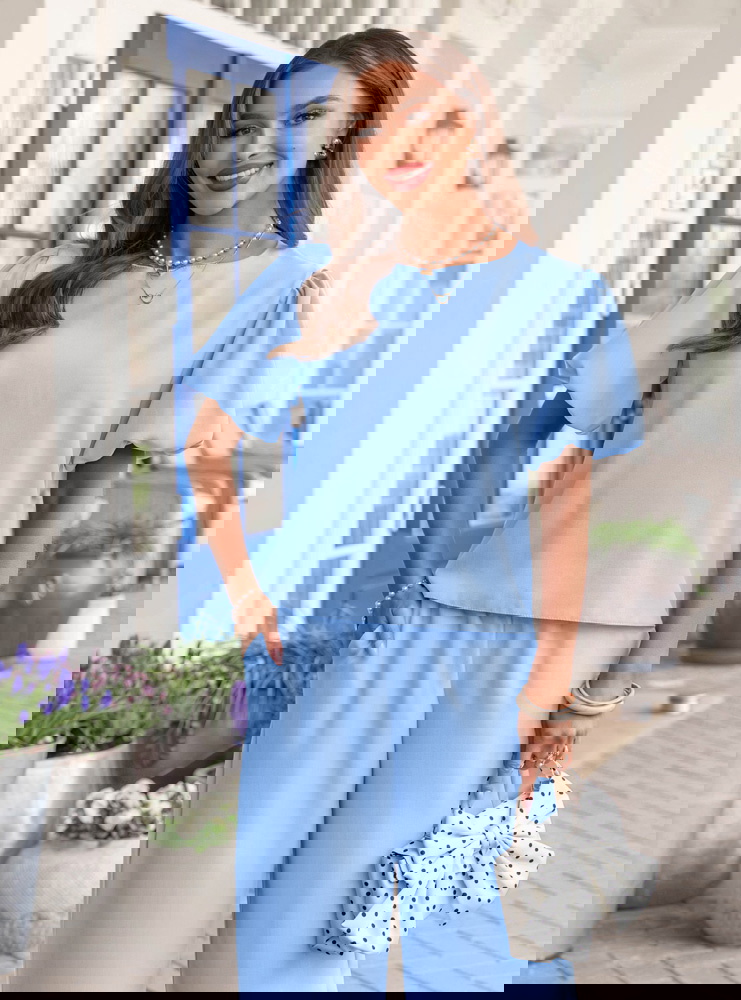 Błękitny komplet bluzka z bufiastymi...