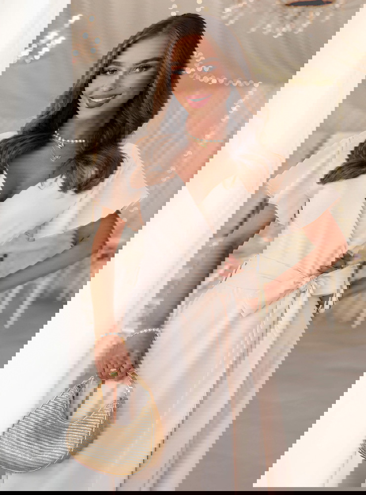 Jasnobeżowa sukienka z przekładanym...